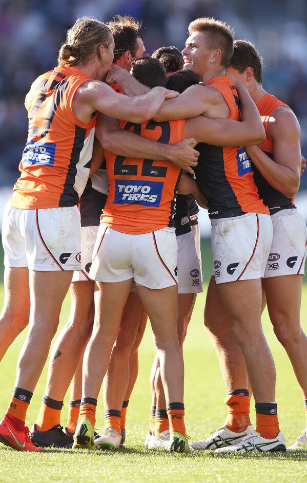 SLIDER-R4MATCHREPORT2019.png A group of GIANTS players celebrate after the final siren. - GWS Giants,AFL,Geelong Cats,GMHBA Stadium